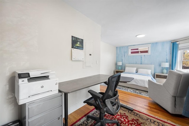 home office with wood finished floors