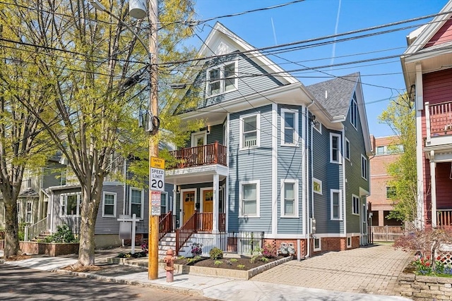 view of front of house with a balcony