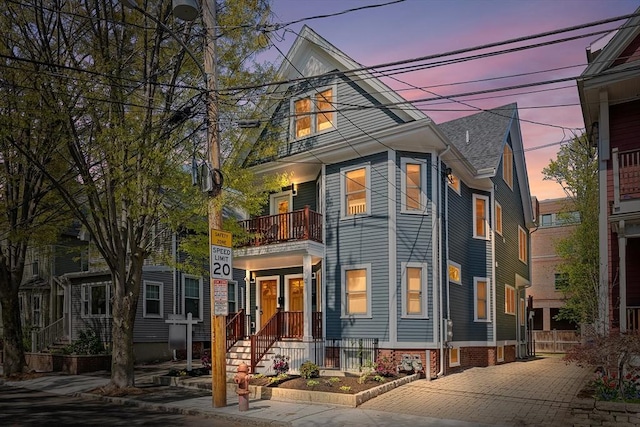 view of front of home with a balcony