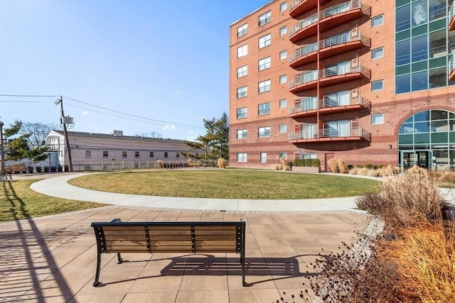 view of home's community featuring a lawn