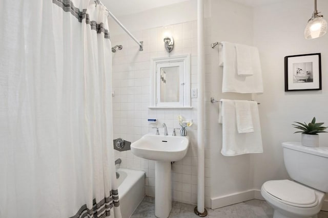 7 Linnaean St Unit 1, Cambridge, MA 02138 - bathroom with toilet, shower / bathtub combination with curtain, baseboards, and tile walls
