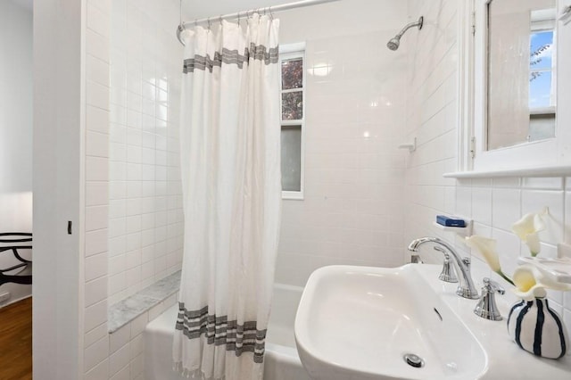 7 Linnaean St Unit 1, Cambridge, MA 02138 - full bathroom with shower / bath combo, a sink, and tile walls