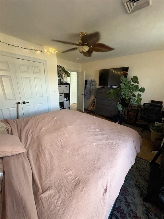 bedroom featuring visible vents and a ceiling fan