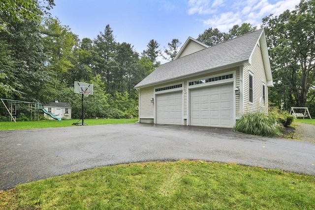 garage featuring driveway