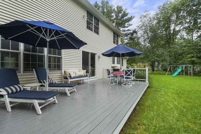 wooden terrace with an outdoor living space, a lawn, outdoor dining area, and a playground