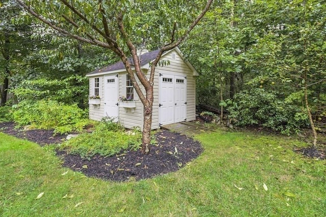 garage featuring a storage shed
