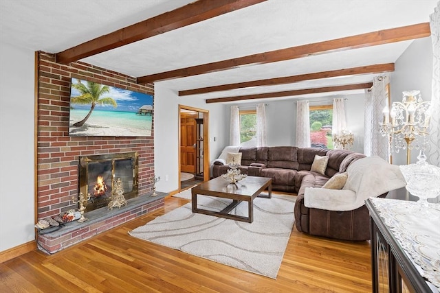 20 Highwood Way, North Andover, MA 01845 - living room with a brick fireplace, wood finished floors, and beamed ceiling