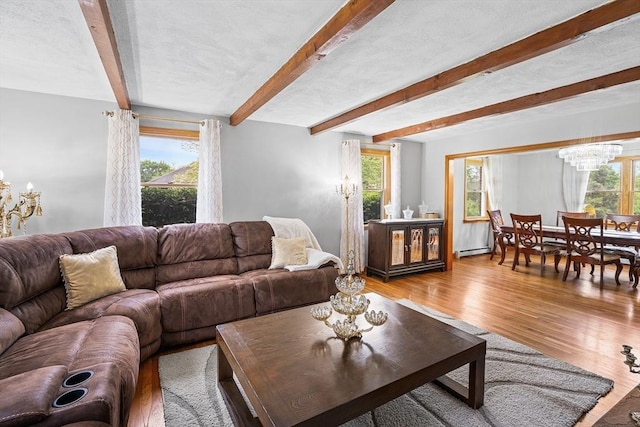 20 Highwood Way, North Andover, MA 01845 - living area with a chandelier, wood finished floors, beamed ceiling, and a baseboard heating unit