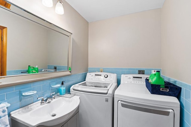 20 Highwood Way, North Andover, MA 01845 - laundry room featuring tile walls, a sink, and a wainscoted wall