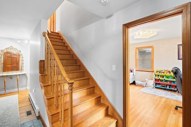 20 Highwood Way, North Andover, MA 01845 - stairs with a baseboard radiator, wood finished floors, and baseboards