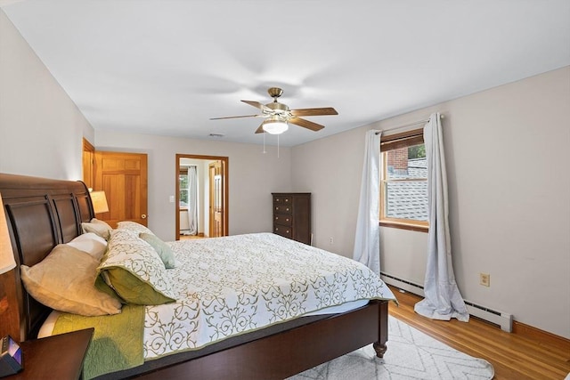 20 Highwood Way, North Andover, MA 01845 - bedroom featuring wood finished floors, a baseboard heating unit, ceiling fan, and baseboards