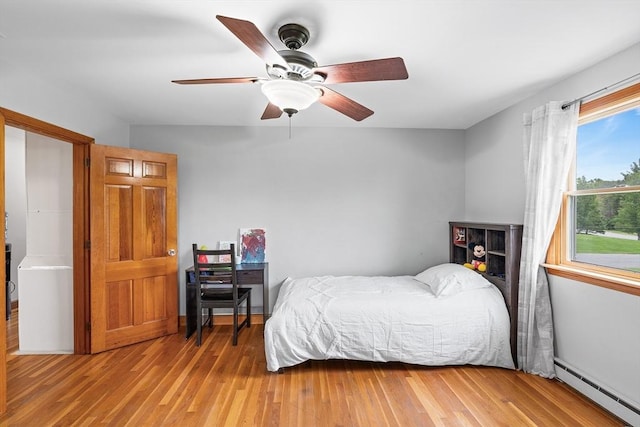 20 Highwood Way, North Andover, MA 01845 - bedroom with a baseboard radiator, light wood-type flooring, and a ceiling fan