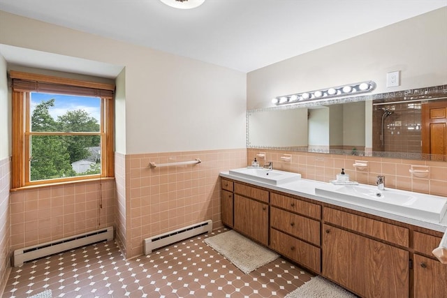 20 Highwood Way, North Andover, MA 01845 - full bathroom with a baseboard radiator, baseboard heating, tile walls, double vanity, and a wainscoted wall