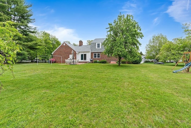 20 Highwood Way, North Andover, MA 01845 - view of grassy yard with a playground and a patio area