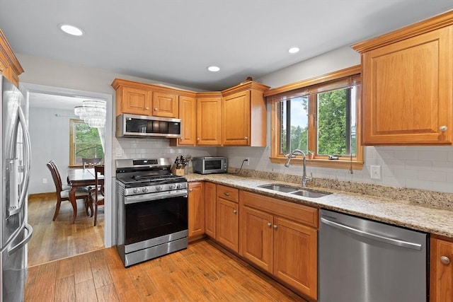 20 Highwood Way, North Andover, MA 01845 - kitchen featuring appliances with stainless steel finishes, a sink, plenty of natural light, light stone countertops, and recessed lighting