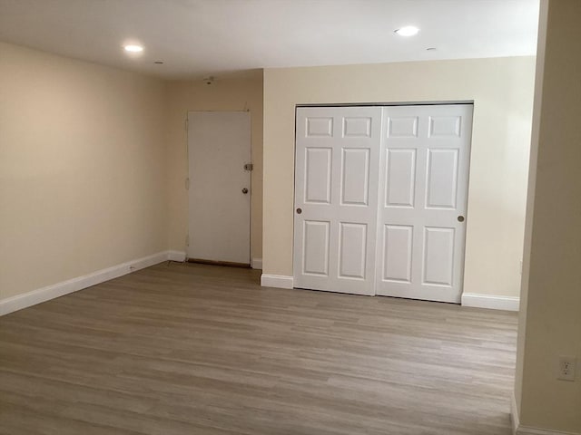566 Commonwealth Ave # 101, Boston, MA 02215 - unfurnished bedroom with wood finished floors, recessed lighting, and a closet