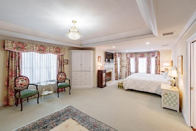 carpeted bedroom featuring a raised ceiling, crown molding, and a notable chandelier