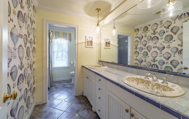 bathroom featuring vanity, ornamental molding, tile patterned floors, toilet, and walk in shower