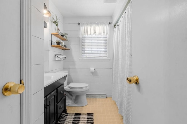 bathroom featuring toilet, tile patterned floors, visible vents, and vanity