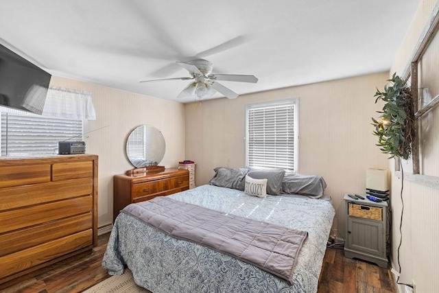 bedroom with ceiling fan and wood finished floors