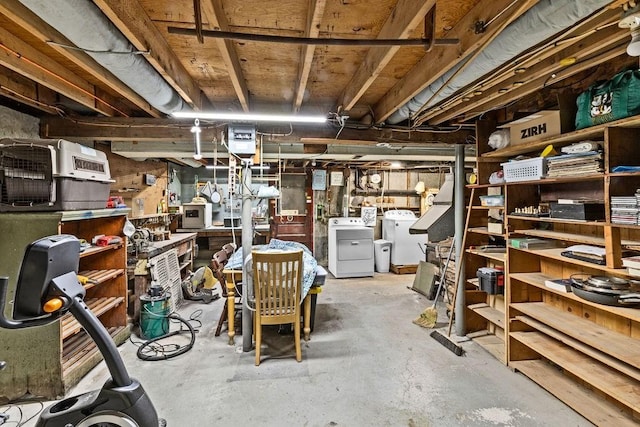 unfinished below grade area featuring washer and dryer