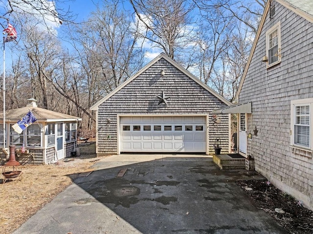 view of side of property featuring a detached garage