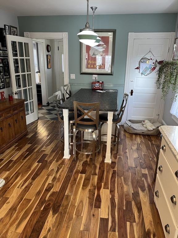 dining space featuring dark wood-type flooring and french doors