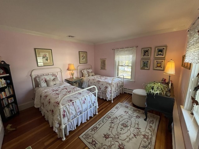 bedroom featuring ornamental molding, dark wood-type flooring, and baseboard heating