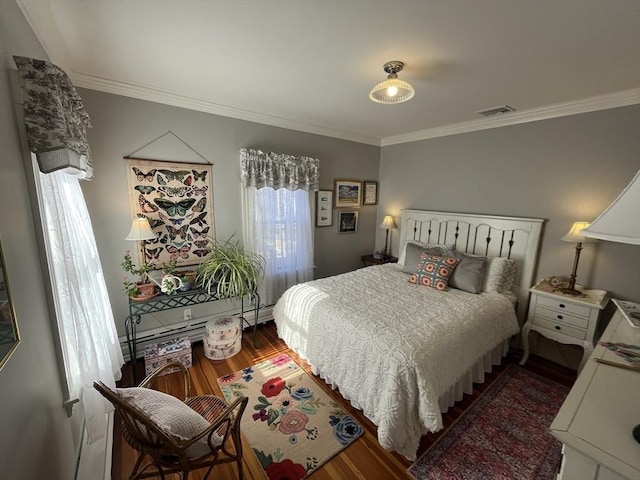 bedroom featuring crown molding and dark hardwood / wood-style floors