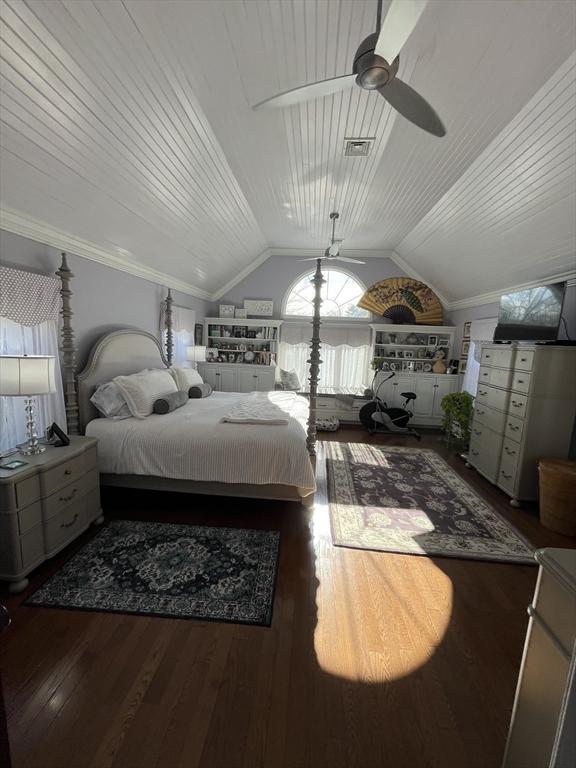 bedroom featuring dark hardwood / wood-style floors, lofted ceiling, ornamental molding, ceiling fan, and wooden ceiling