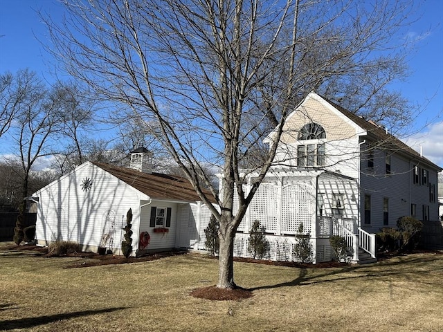 view of home's exterior featuring a yard