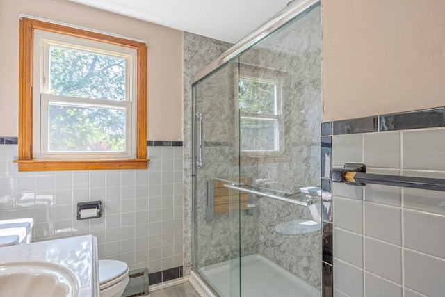 121 Donlyn Dr, Chicopee, MA 01013 - bathroom with tile walls, a shower stall, vanity, and wainscoting
