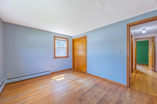 121 Donlyn Dr, Chicopee, MA 01013 - spare room featuring wood-type flooring and a baseboard radiator