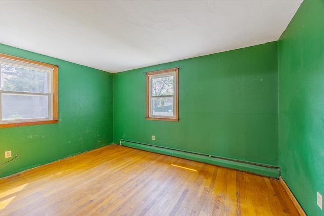 121 Donlyn Dr, Chicopee, MA 01013 - spare room featuring baseboard heating and wood finished floors