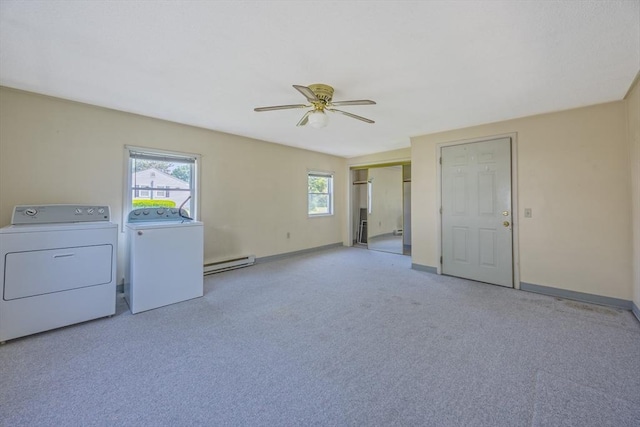 121 Donlyn Dr, Chicopee, MA 01013 - laundry room with washer and dryer, baseboard heating, ceiling fan, and carpet flooring