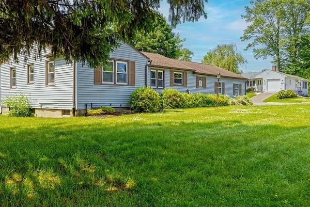 121 Donlyn Dr, Chicopee, MA 01013 - ranch-style house featuring a front yard and a detached garage