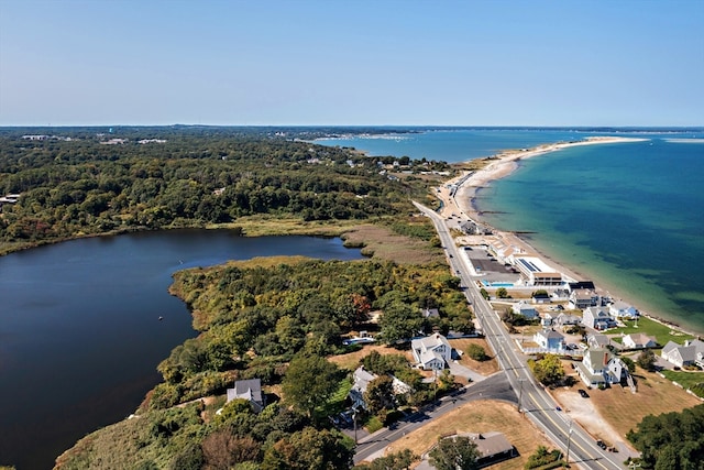 drone / aerial view featuring a view of the beach and a water view