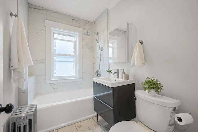full bath featuring radiator heating unit, toilet, marble finish floors, vanity, and bathtub / shower combination