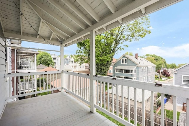 wooden deck featuring a residential view