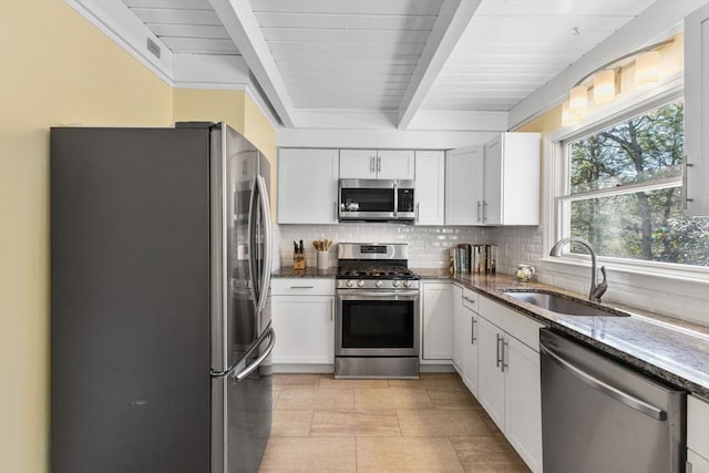 11 White Oak Trl, Barnstable, MA 02632 - kitchen featuring stainless steel appliances, a sink, beamed ceiling, decorative backsplash, and dark stone counters