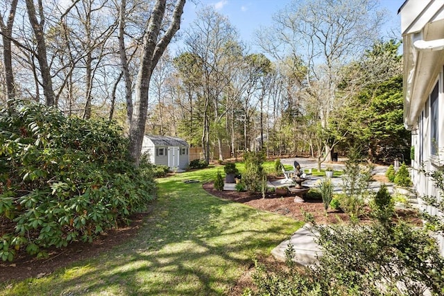 11 White Oak Trl, Barnstable, MA 02632 - view of green lawn featuring an outdoor structure and a storage shed