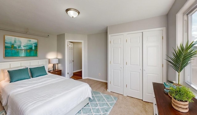 carpeted bedroom featuring a closet