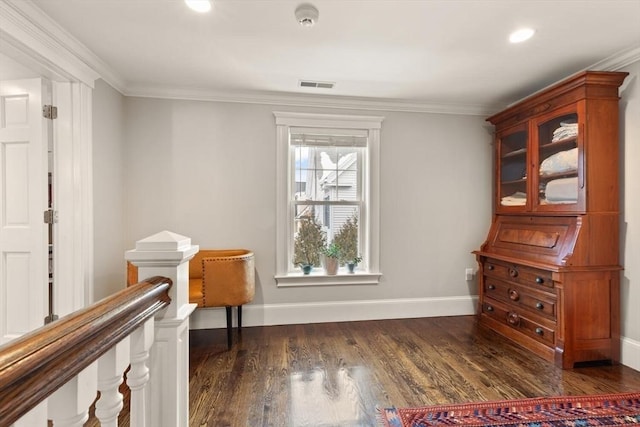 sitting room featuring crown molding, dark wood finished floors, visible vents, and baseboards