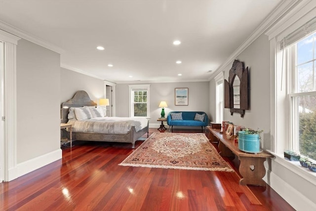 bedroom featuring crown molding, baseboards, and dark wood-style flooring