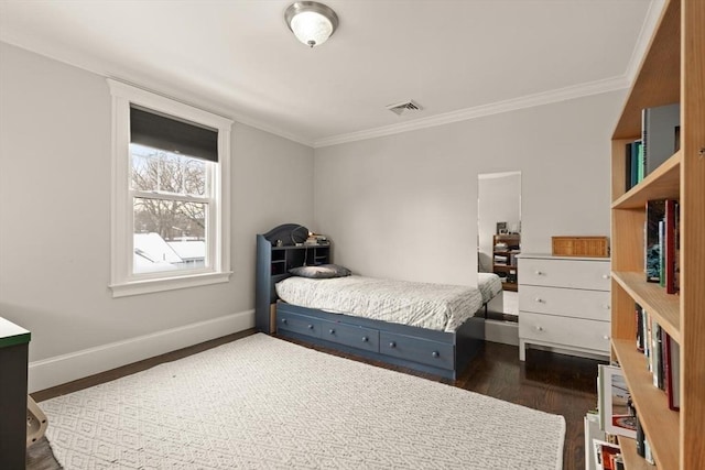 bedroom with ornamental molding, dark wood finished floors, visible vents, and baseboards