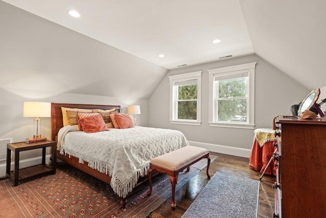 bedroom featuring visible vents, baseboards, dark wood-style floors, vaulted ceiling, and recessed lighting