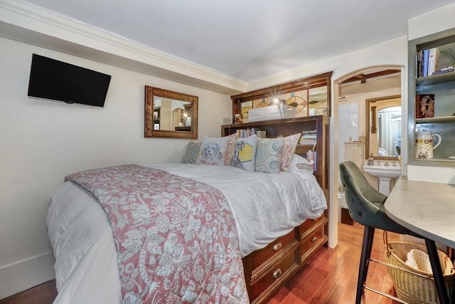 bedroom with hardwood / wood-style floors