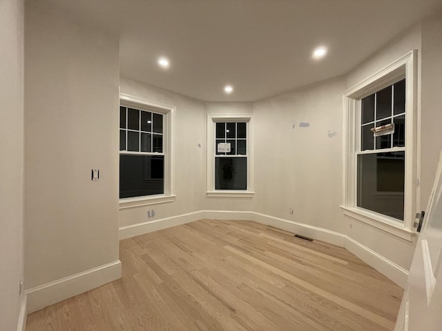 unfurnished room featuring light hardwood / wood-style floors