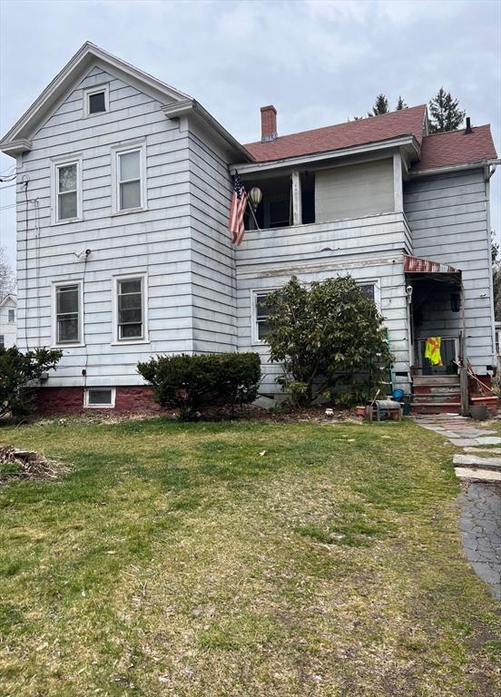 1 Barber Ave, Greenfield, MA 01301 - rear view of house with a chimney and a lawn