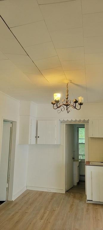 1 Barber Ave, Greenfield, MA 01301 - unfurnished dining area featuring a chandelier and light wood finished floors